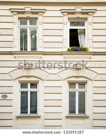 Classical building facade with an open window