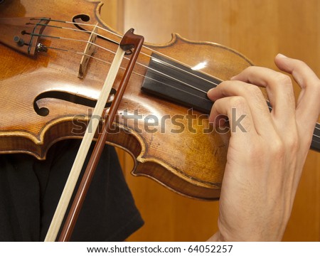 Close up on violin playing