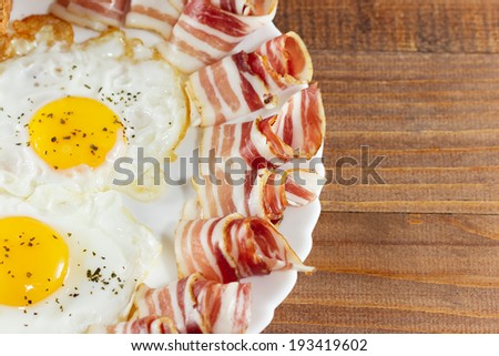 Breakfast including bacon and eggs