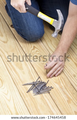 Man Hammering Nails