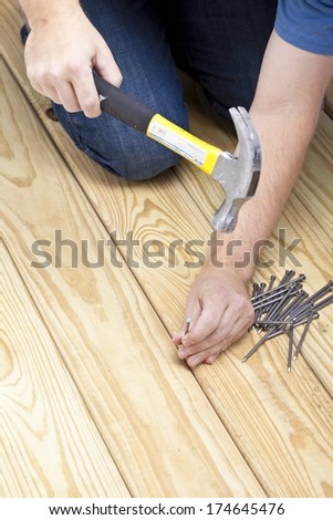 Man Hammering Nails