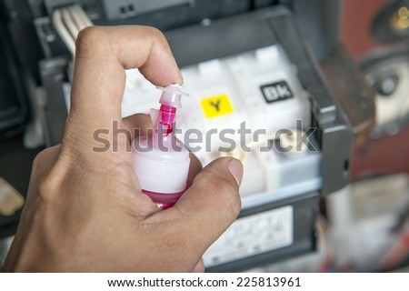 Ink jet printer cartridge refilling