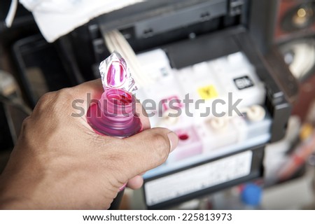 Ink jet printer cartridge refilling