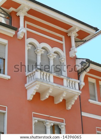 A beautiful window with balcony on a upper class house in Italy