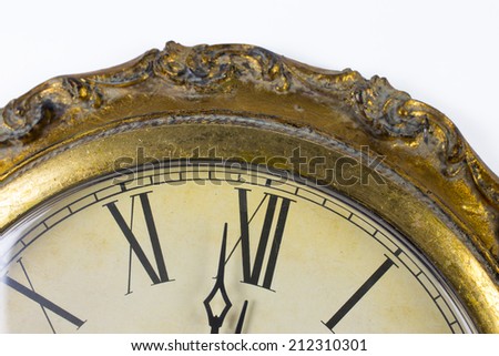 Close up view on clock face of a historical watches with golden frame
