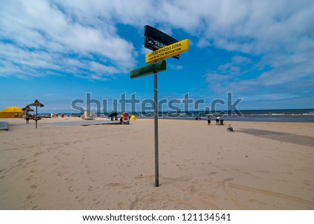 Signpost on the beach: \