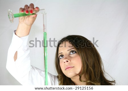 A chemistry student fills a burette with a green solution