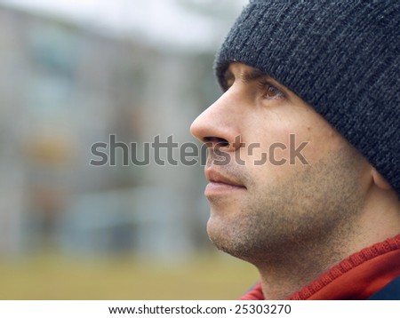 Unshaven Man In Tuque Looking Ahead Portrait