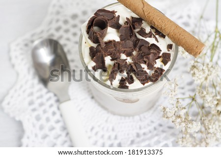 Delicious dessert, chocolate and whipped cream, very cold, decorate with chocolate curls,
