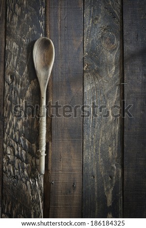 Wooden kitchenware on brown background, texture for menus and cooking needs
