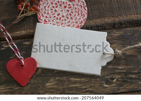 White labels, lace and rustic wooden background thread in geometric shapes