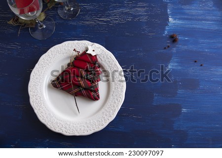 Christmas Dinner rustic, white plate, and napkin red boxes in the shape of tree, Blue background