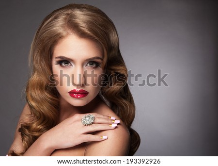 Beautiful woman with red lips and elegant hair-do