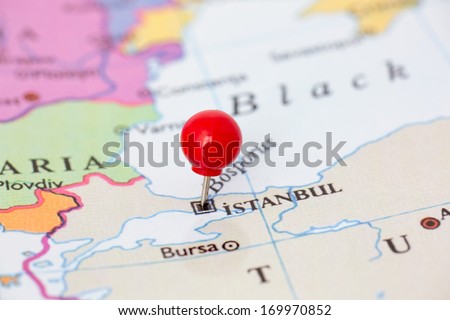Round red thumb tack pinched through city of Istanbul on Turkey map. Part of collection covering all major capitals of Europe.