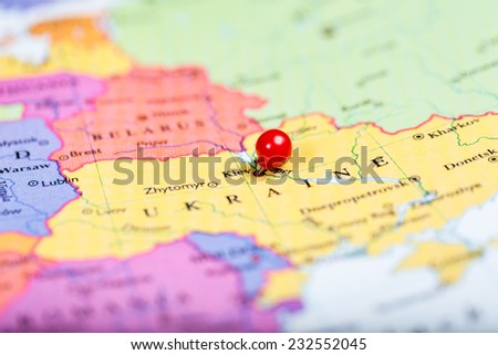 Map of Europe with a round red push pin placed on the city of Kiev