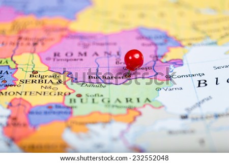 Map of Europe with a round red push pin placed on the city of Bucharest