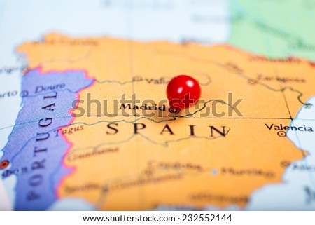 Map of Europe with a round red push pin placed on the city of Madrid