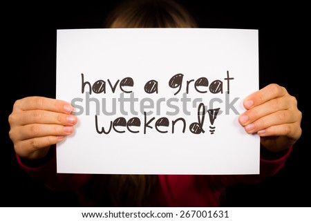 Studio shot of child holding a Have a Great Weekend sign made of white paper with handwriting.
