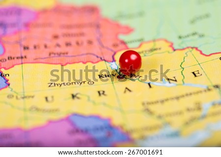 Map of Europe with a round red push pin placed on the city of Kiev