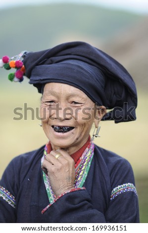 NA TAM VILLAGE, LAO CAI, 30 SEPT 2011-Unidentified Lao ethnic woman with her traditional black colored clothing and silver accessories on 30, 2011 Na Tam Village Lao Cai Vietnam