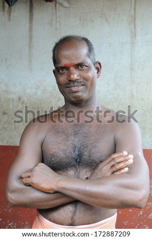 KERALA, INDIA - NOVEMBER 26 ; Unidentified Indian man smiles and poses for camera in Kerala, India on November 26, 2011