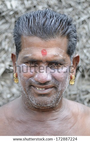 KERALA, INDIA - NOVEMBER 26: An unidentified Indian man smiling for portrait shot on November 26, 2011 in Kerala, India