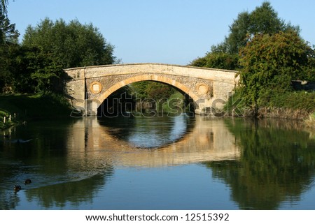 Small bridge and its reflection on the river