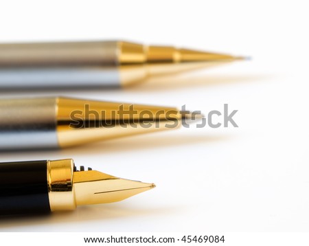 Three types of writing equipment  on a bright background.