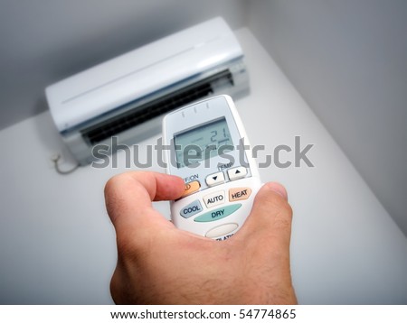 Closeup view about using some appliance such as air condition.