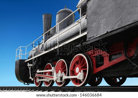 Old steam locomotive against blue sky