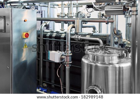 Dairy factory with milk pasteurization tank and pipes