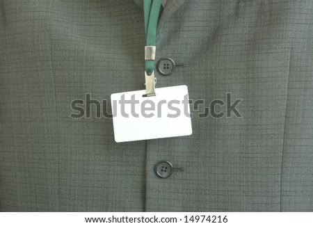 Business man in  suit with name tag, insert your own text etc.