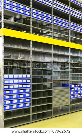 Shelves, boxes and racks in distribution warehouse interior