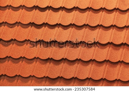 Red roof tiles on the roof of a modern home