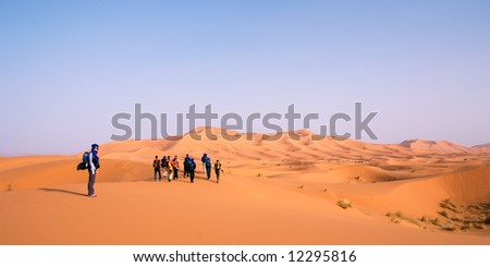 Hiking Group in the Sahara Desert at Erg Chebbi, Morocco
