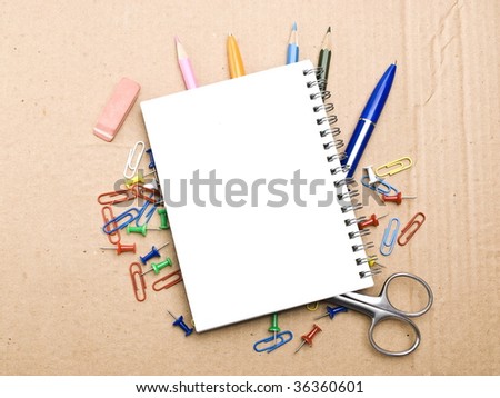 Office tools on cardboard background
