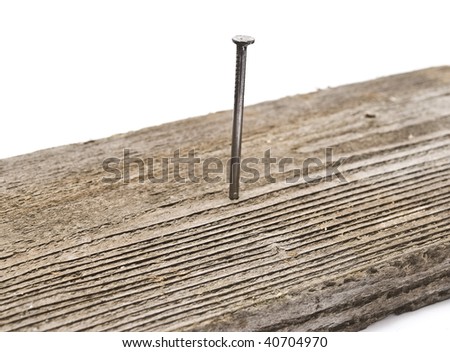 Nail in wooden board