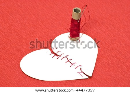 Sewn Broken Heart. stock photo : Broken heart and