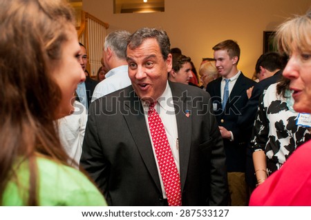 New Jersey Gov. Chris Christie speaks with voters at a house party in Bedford, New Hampshire, on June 8, 2015.