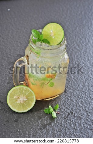 Lemon juice mix with plum juice of bottle glass.