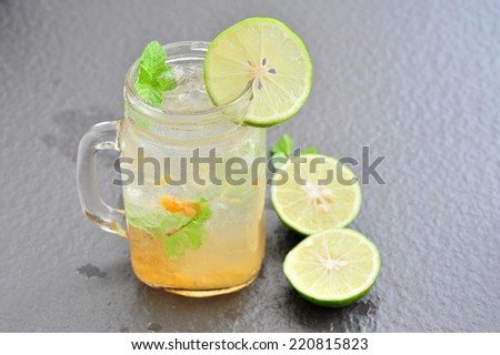 Lemon juice mix with plum juice of bottle glass.