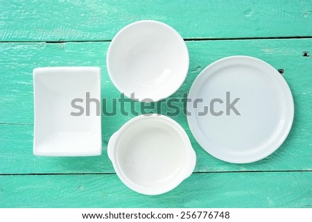 Blank Kitchenware on wood table.