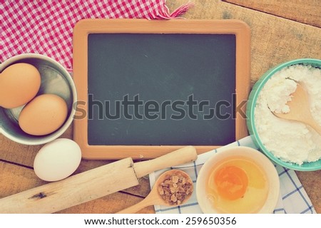 Vintage of the old blank small blackboard with ingredients of cake.