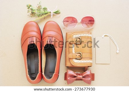 Vintage of leather shoe , leather bag,eye wear,leather bag and tag price  on wood background.