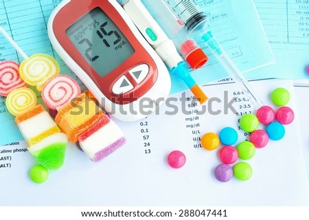 Glucometer with unhealthy food,diabetes concept.