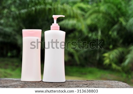 Clean body lotion bottle on wood table.