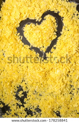 Grandmother\'s home made pasta on black surface and a heart shape; valentine day. for background