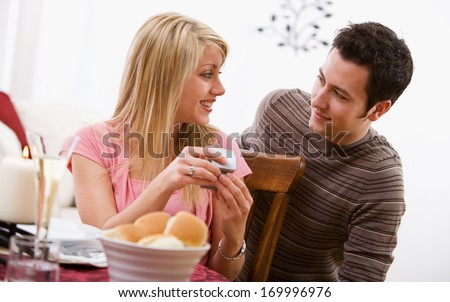 Valentine's Day holiday series with young Caucasian couple enjoying a romantic dinner together.