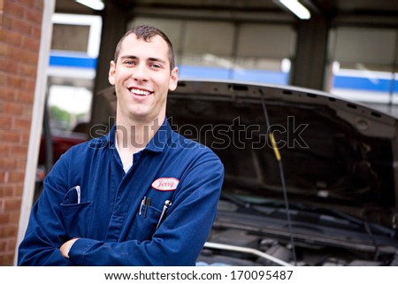 Mechanic: Smiling automotive technician.