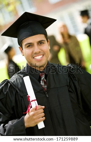 Graduation: Hispanic Student Holding Diploma